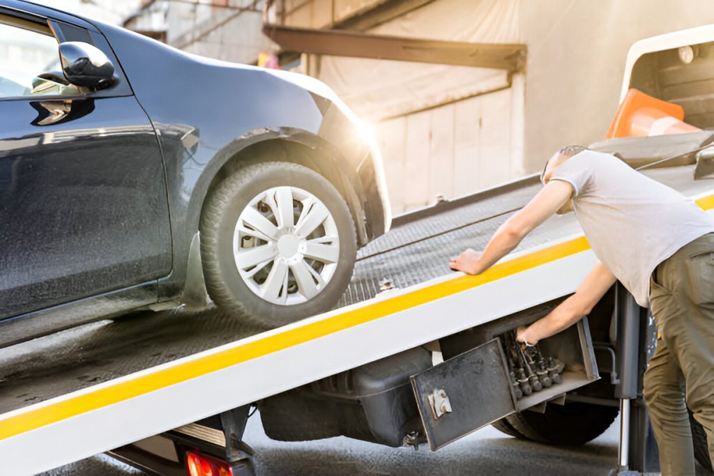 Car loading onto tow truck