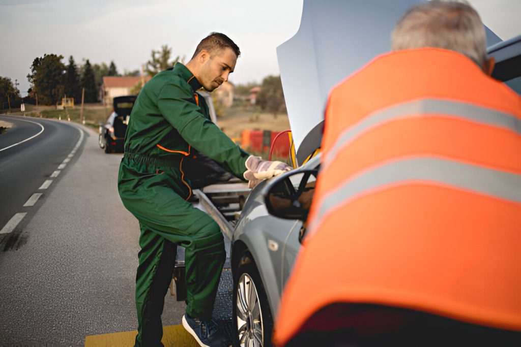 Roadside mechanic fixing car engine